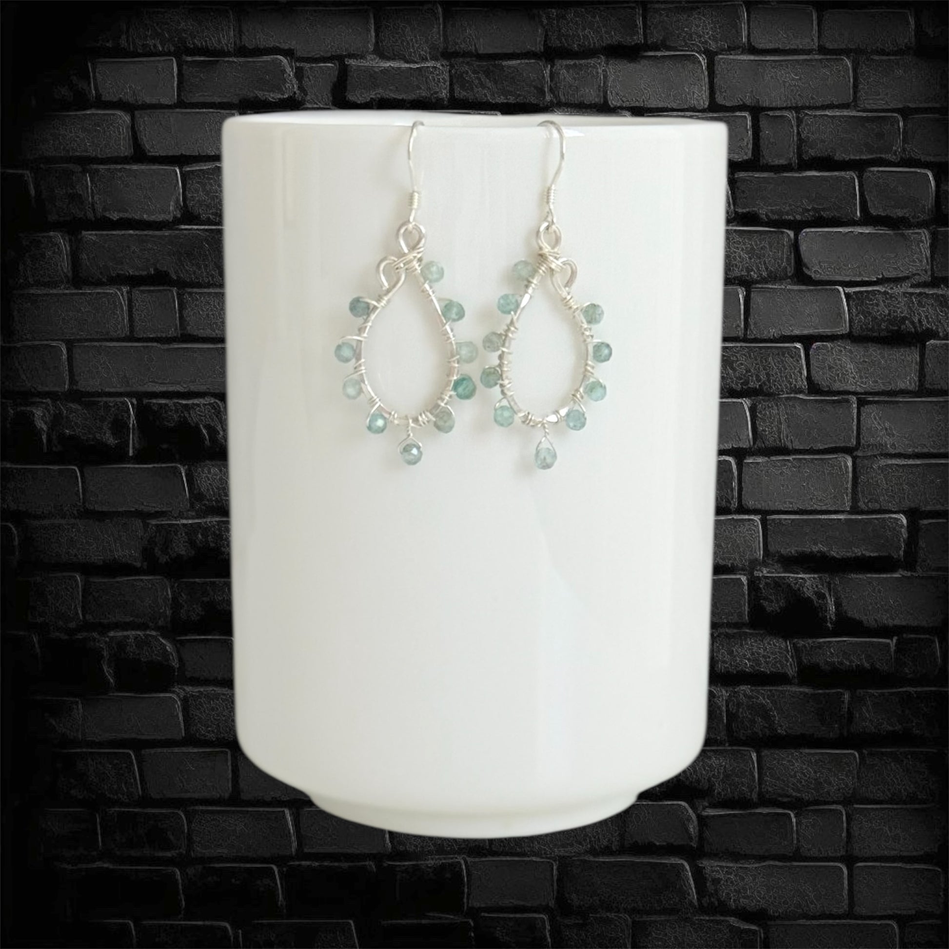 Handcrafted hoops with faceted green apatite gems