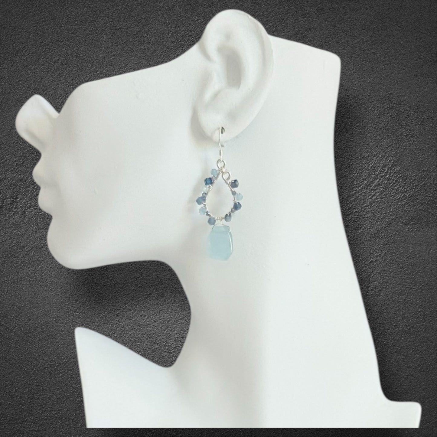 Elegant sterling silver teardrop earrings featuring aquamarine, kyanite and tanzanite gemstones, handmade design