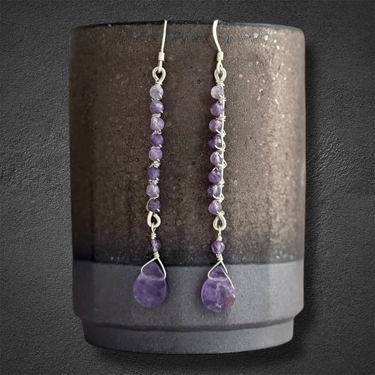 Handmade sterling silver earrings, featuring small faceted natural amethyst gemstones and amethyst drop