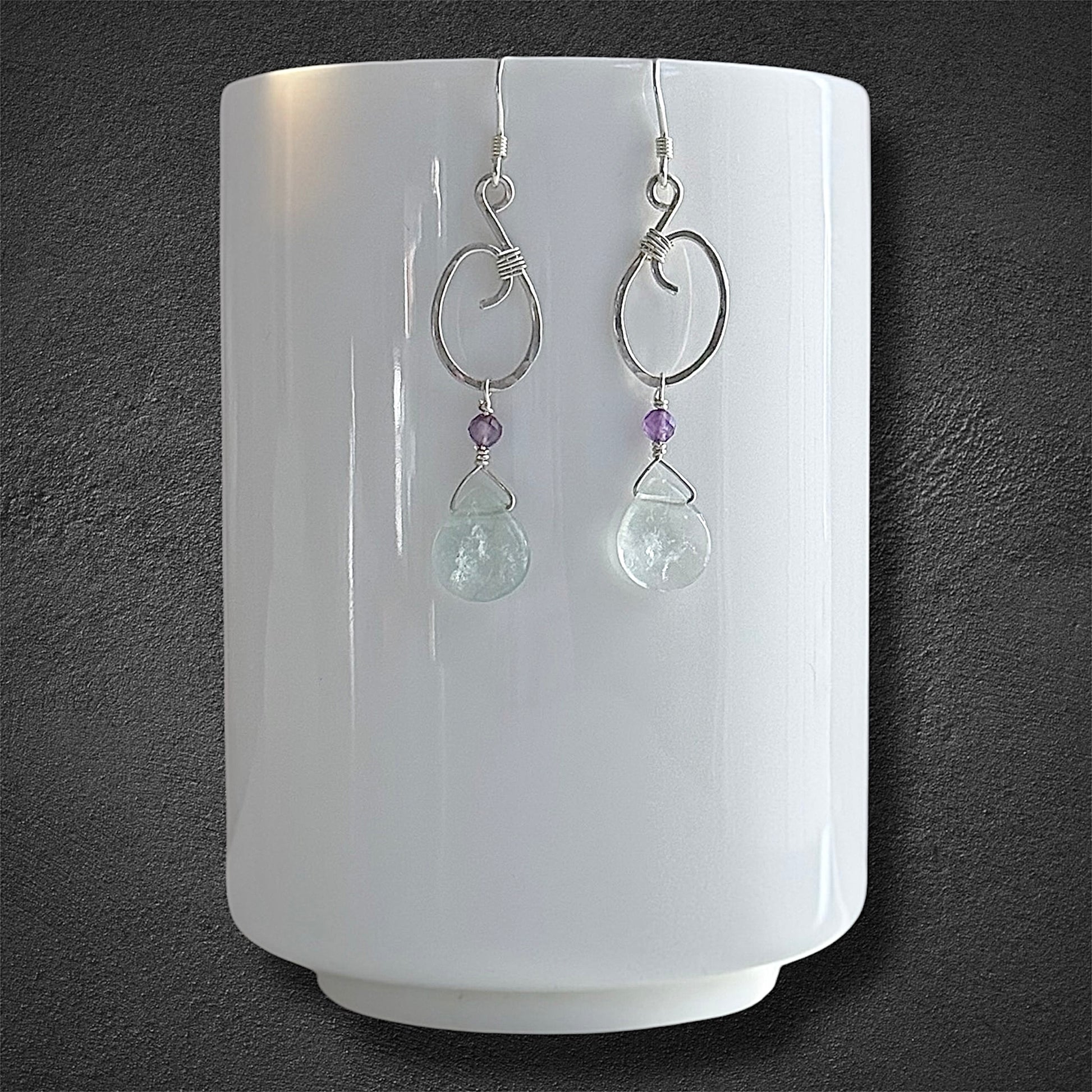 Artisanal handmade sterling silver earrings with green fluorite and amethyst gemstones